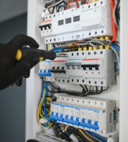 closeup-electrician-working-circuitry-min